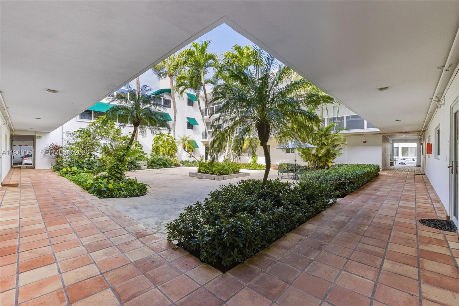 1 Harbour Way, Unit 108 Bal Harbour, FL 33154 - Photo 25 of 27 a front view of a house with garden