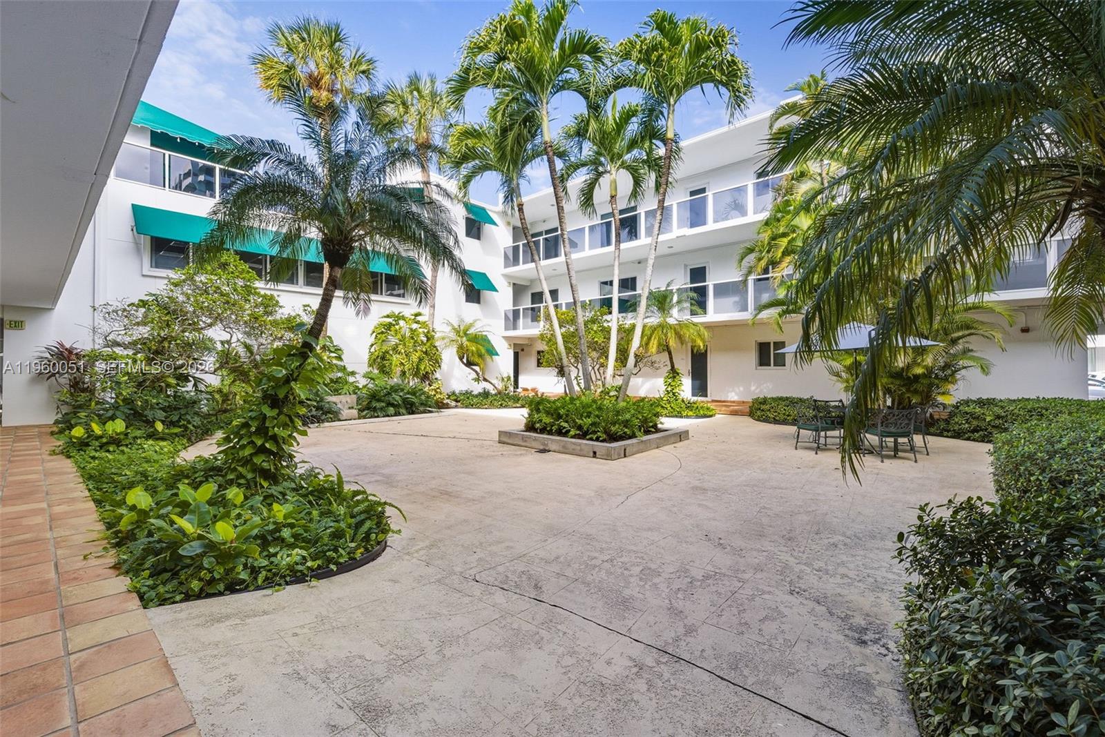 1 Harbour Way, Unit 108 Bal Harbour, FL 33154 - Photo 26 of 27 a view of a building with a yard and potted plants