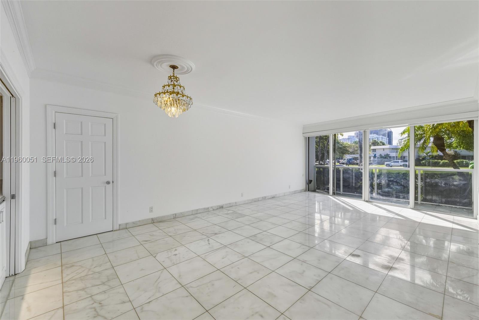 1 Harbour Way, Unit 108 Bal Harbour, FL 33154 - Photo 6 of 27 a view of empty room with wooden floor and fan
