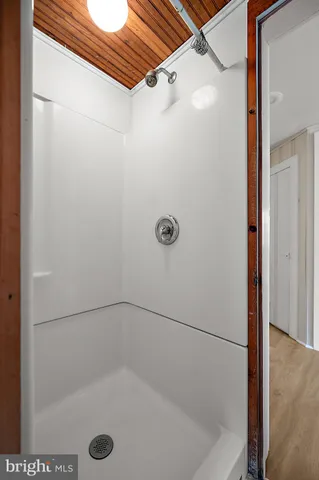 a kitchen with appliances cabinets and a window