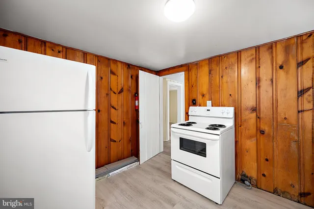 a view of a livingroom with wooden floor