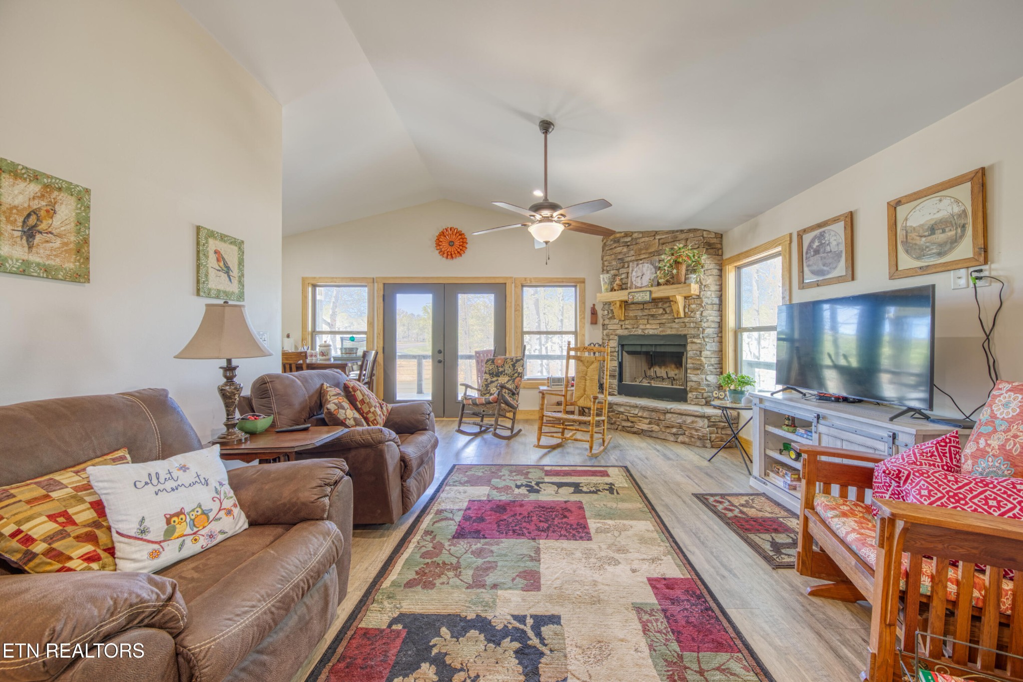 1040 Rdg Pt Trail Dandridge, TN 37725 - Photo 13 of 31 a living room with furniture flat screen tv and a fireplace