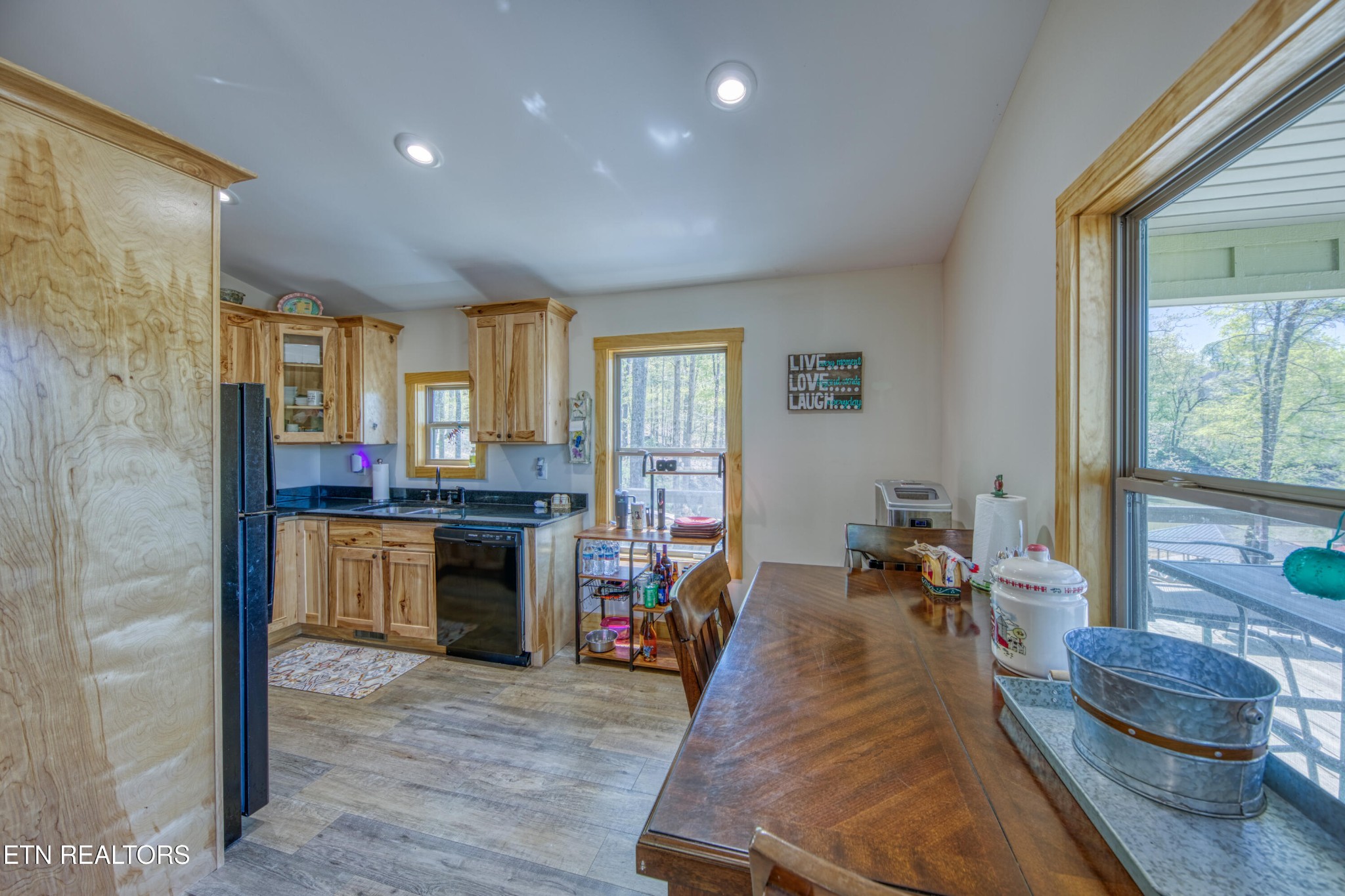 1040 Rdg Pt Trail Dandridge, TN 37725 - Photo 15 of 31 a living room with stainless steel appliances granite countertop furniture and a wooden floor