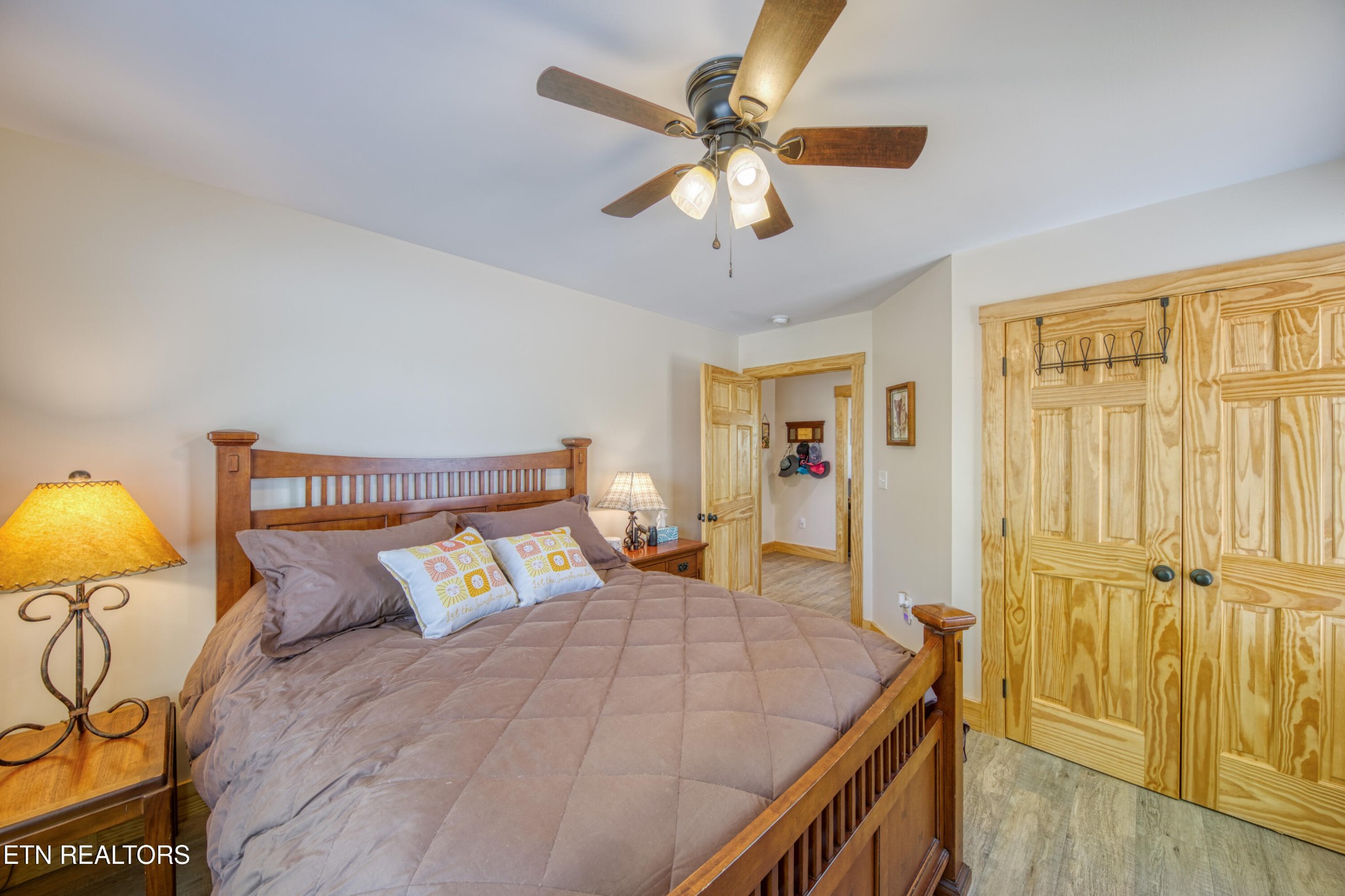 1040 Rdg Pt Trail Dandridge, TN 37725 - Photo 19 of 31 a bedroom with a bed and a chandelier