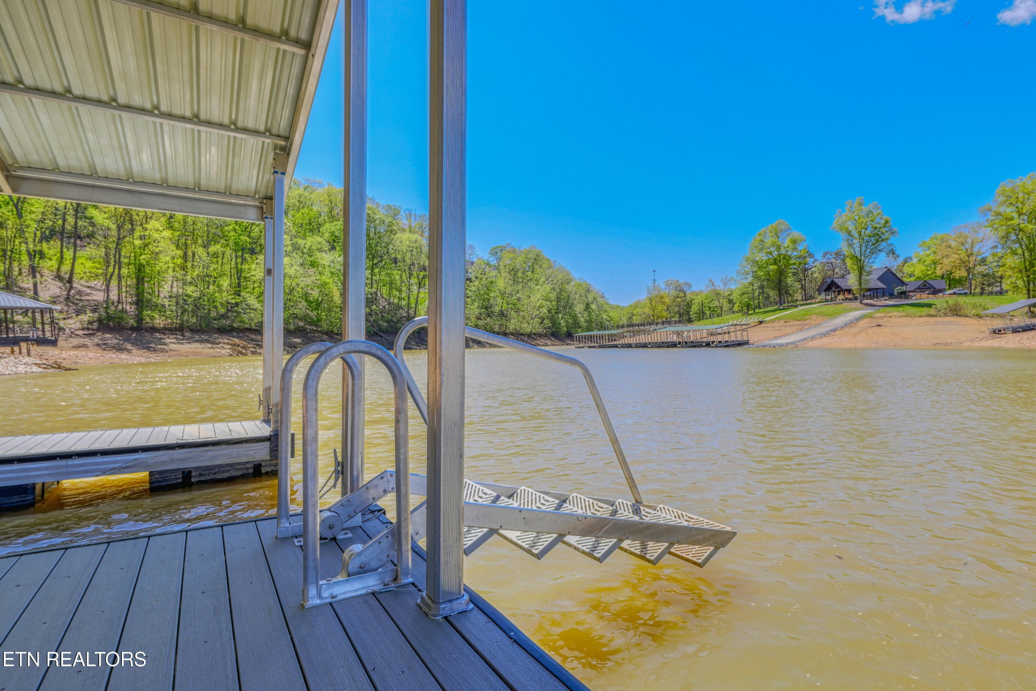 1040 Rdg Pt Trail Dandridge, TN 37725 - Photo 29 of 31 a view of a balcony with chair and wooden floor