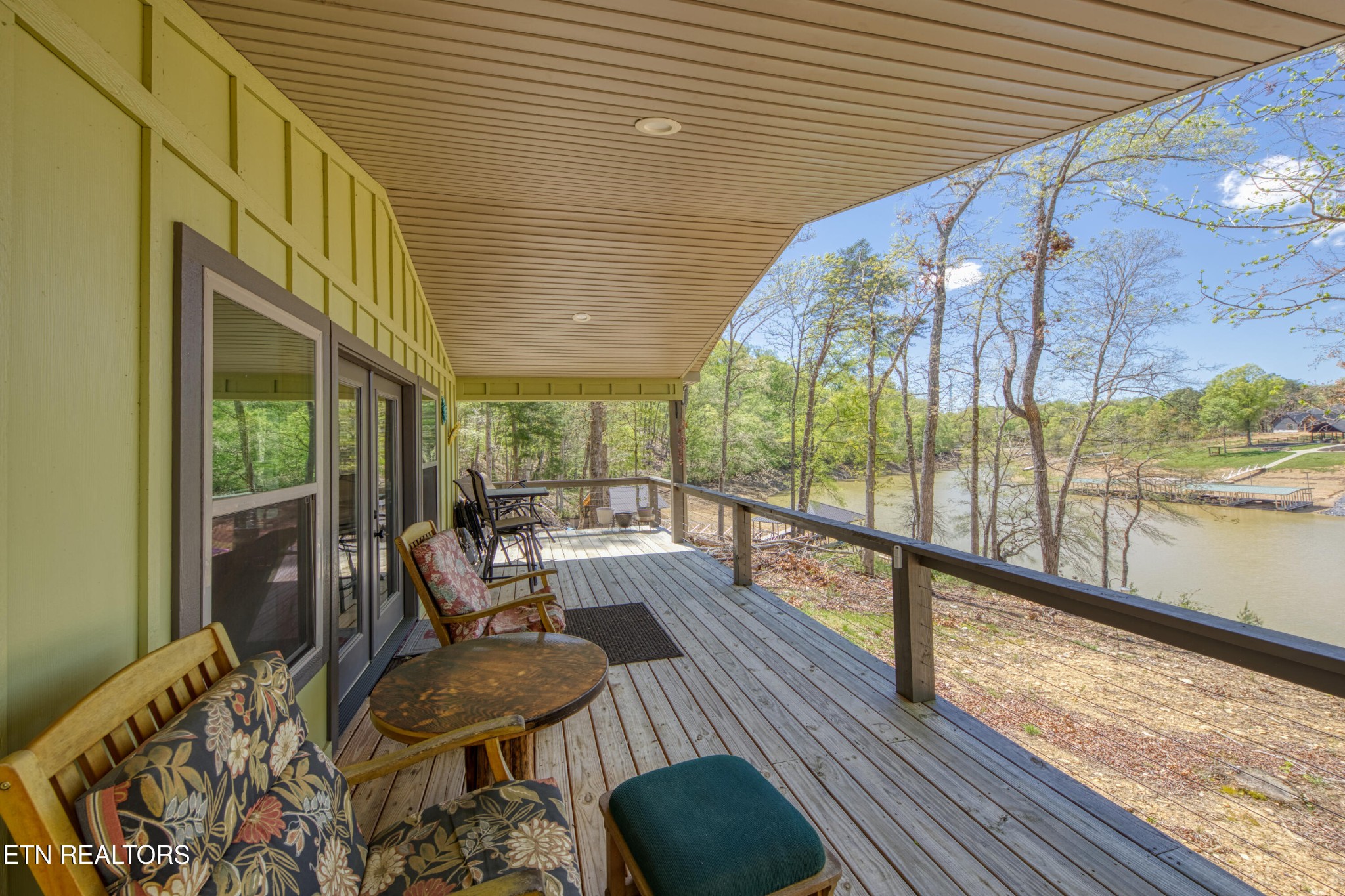 1040 Rdg Pt Trail Dandridge, TN 37725 - Photo 10 of 31 a balcony with wooden floor and furniture