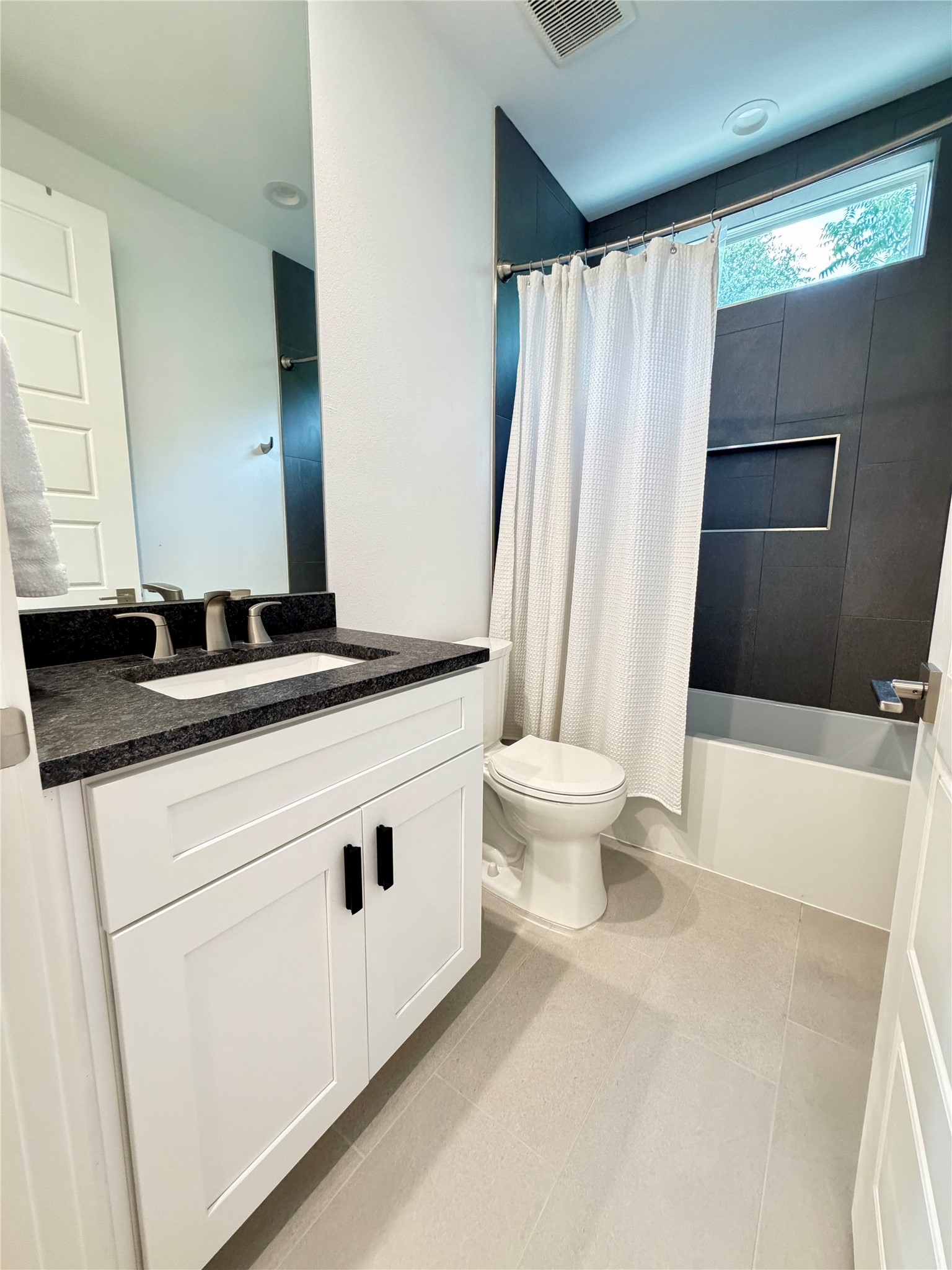 6102 Ponca Street, Unit 2 Austin, TX 78741 - Photo 13 of 24 Main level full bath