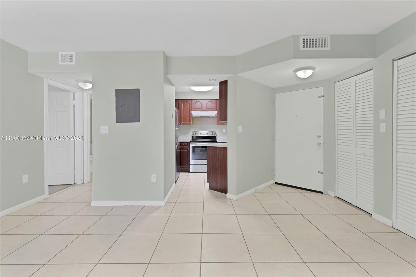 a kitchen with stainless steel appliances cabinets and glass door
