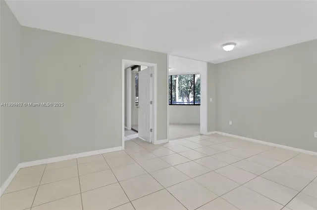 a view of an empty room and window