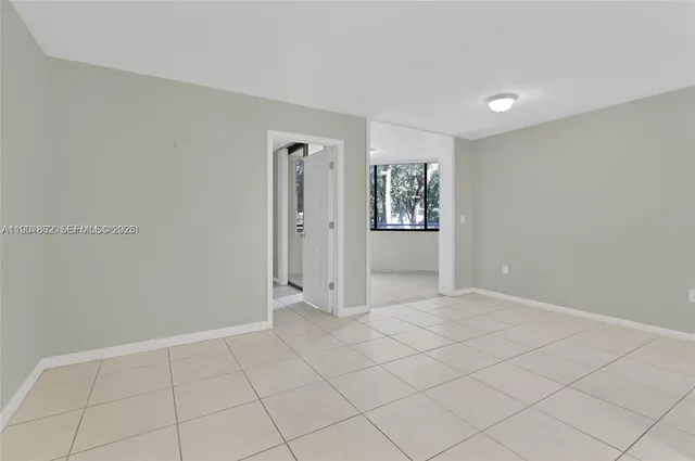 a view of an empty room and window