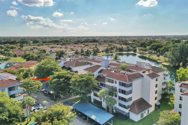 an aerial view of multiple houses with yard