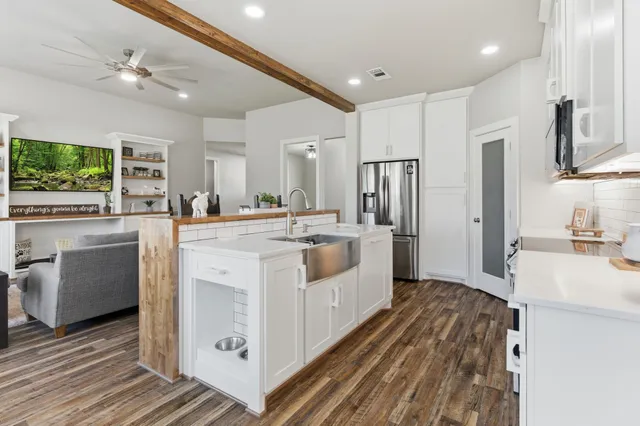 a kitchen with a sink stove and refrigerator