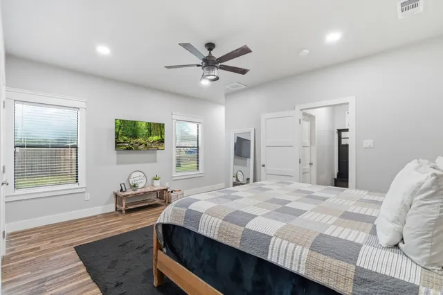 a bedroom with a bed and a window