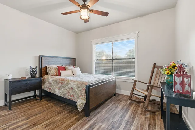 a bedroom with a bed and a table