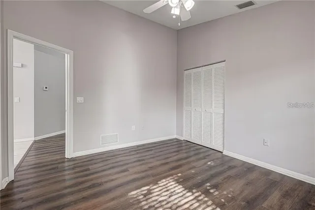 a view of a dining room with furniture and a chandelier
