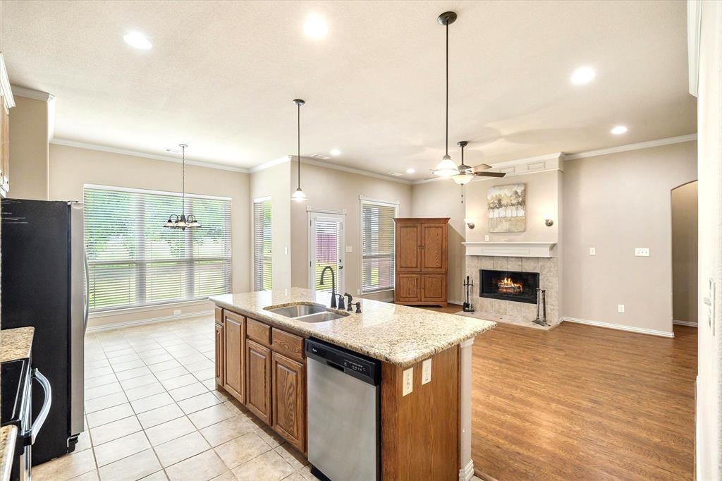 1852 Meadowview Canton, TX 75103 - Photo 11 of 28 a large kitchen with kitchen island a large counter top a sink stainless steel appliances and cabinets