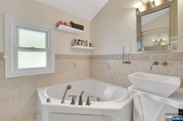 a bathroom with a toilet a sink and shower