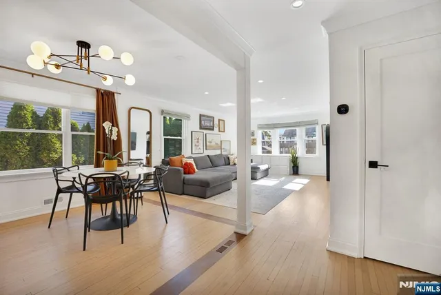 a living room with furniture a dining table and chairs