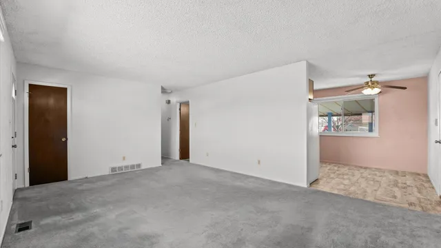 an empty room with shelves