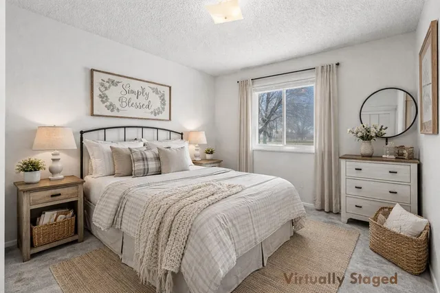 a bedroom with a bed and a dresser