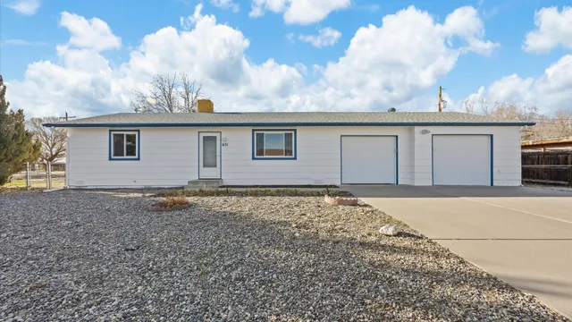 a backyard of a house with large trees
