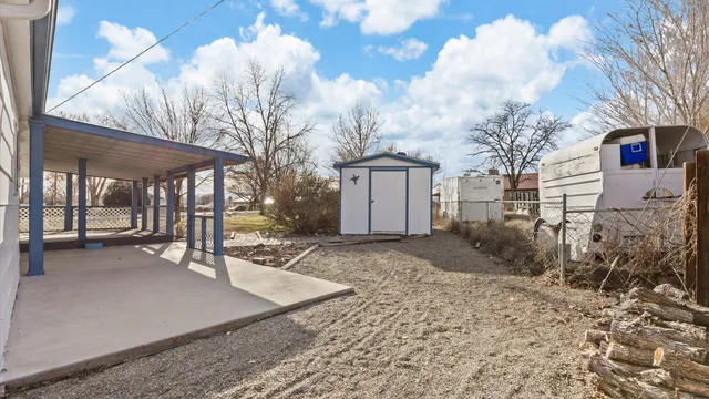 a view of a house with a snow in the yard