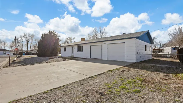 a view of a house with a snow on the road