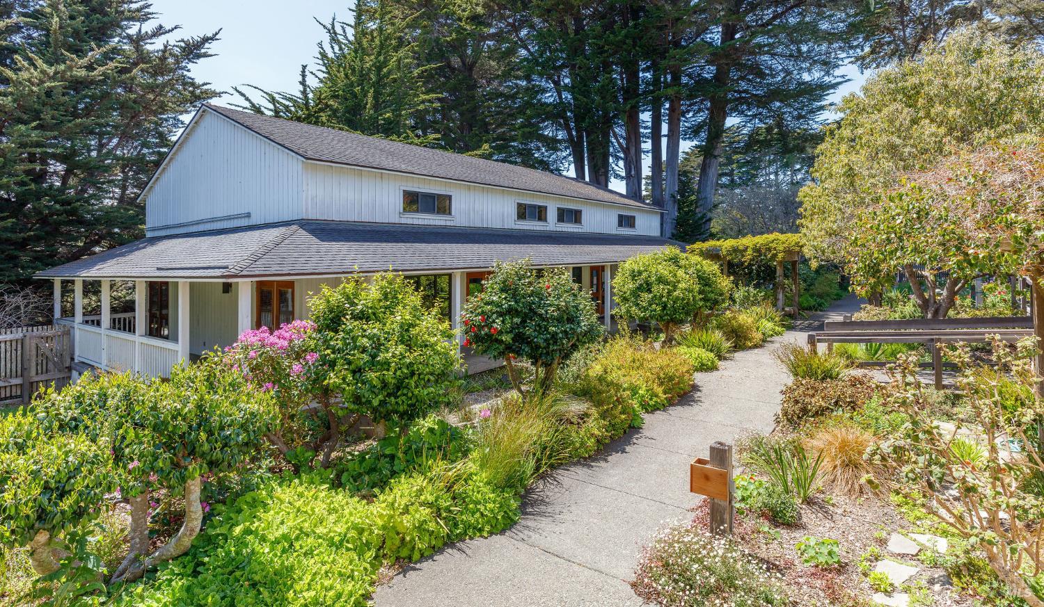 355 Chinquapin Lane The Sea Ranch, CA 95497 - Photo 22 of 31 a front view of house with yard and green space