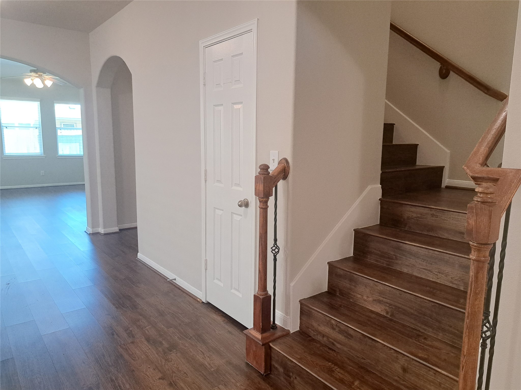 26315 Fox Ridge Lane Katy, TX 77494 - Photo 4 of 39 a view of a hallway with wooden floor and stairs