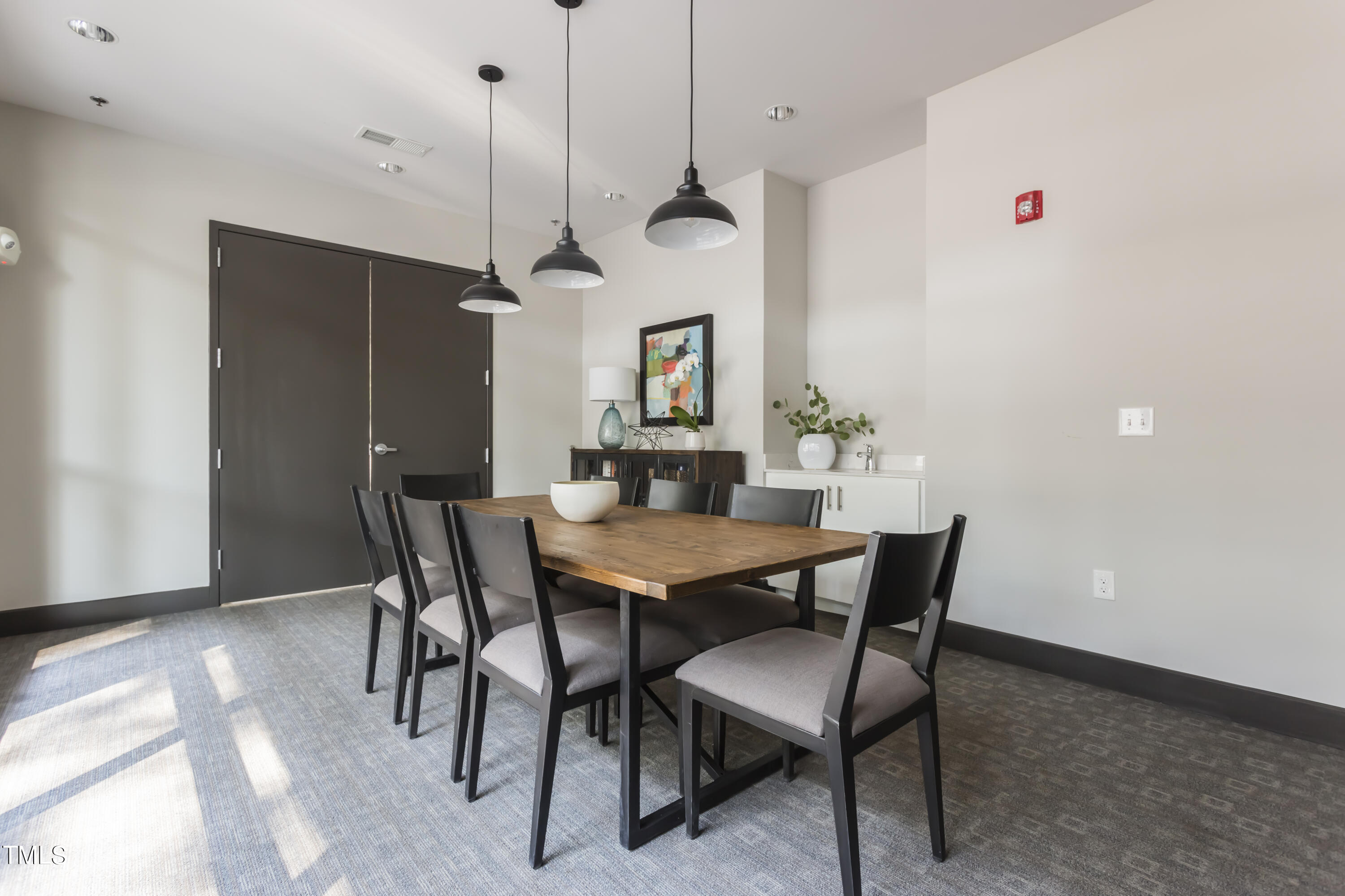 1300 St Marys Street, Unit 301 Raleigh, NC 27605 - Photo 18 of 27 a view of a dining room with furniture
