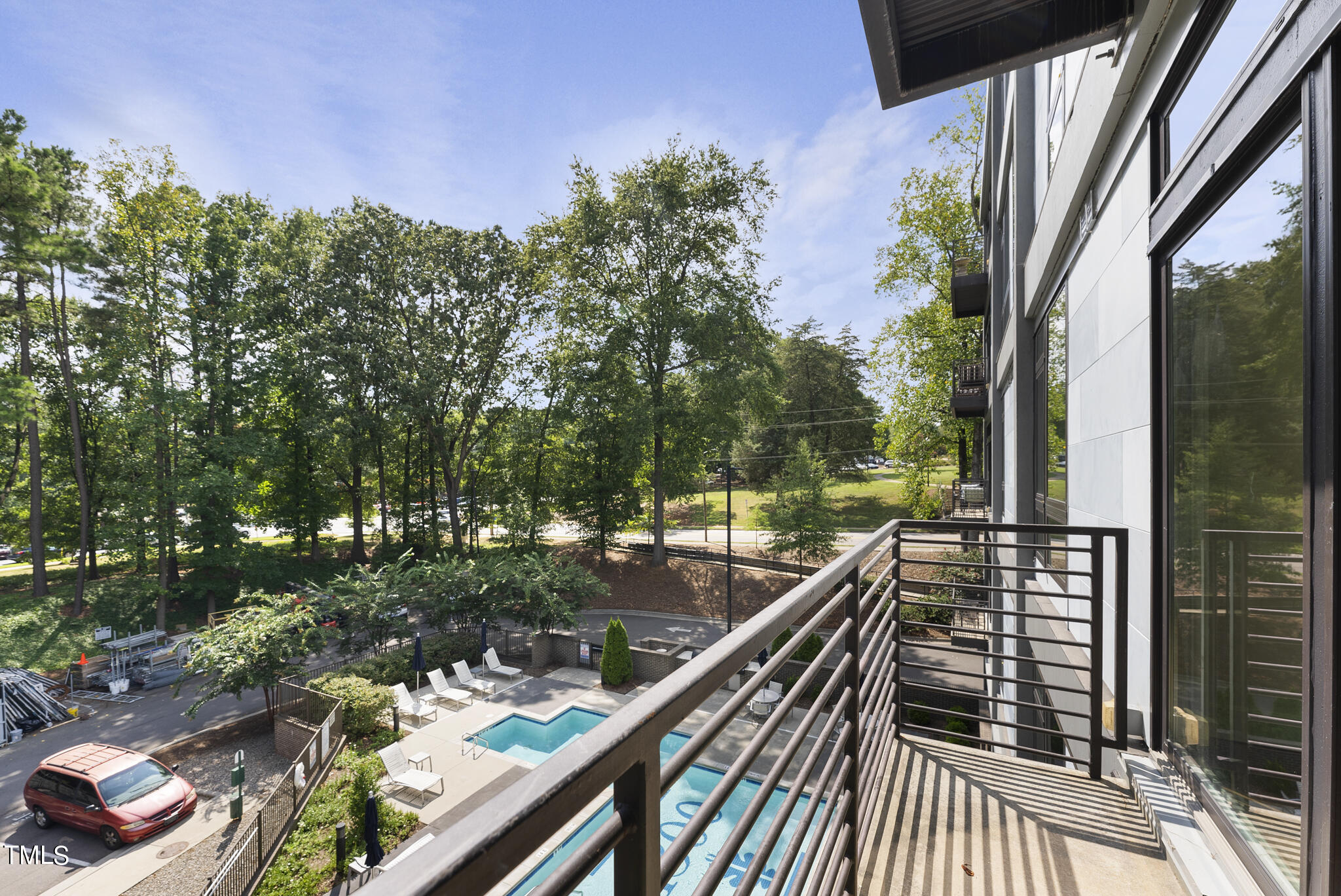 1300 St Marys Street, Unit 301 Raleigh, NC 27605 - Photo 6 of 27 a view of balcony with wooden floor and fence