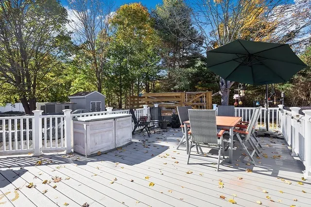 a view of backyard with a patio and outdoor seating