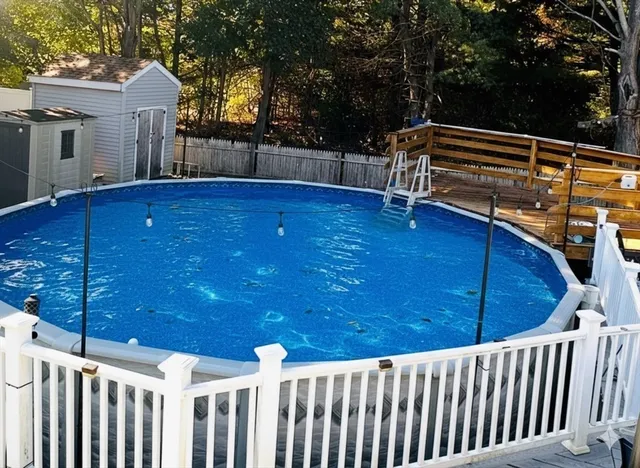 a view of outdoor space and deck with a backyard