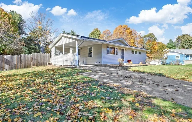 a view of a house with a yard