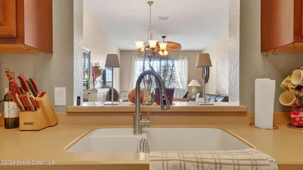 a bathroom with a sink a toilet a mirror and shower