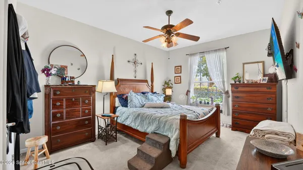 a swimming pool with an outdoor space and seating area