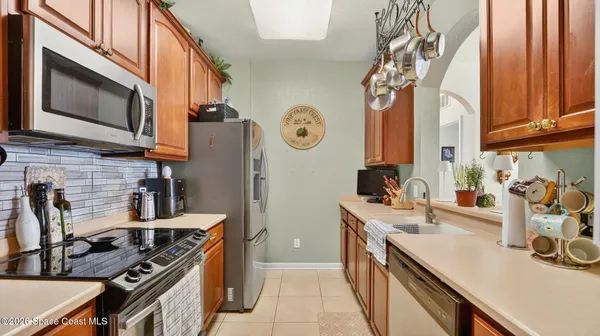 a bed room with a bed and a painting on the wall