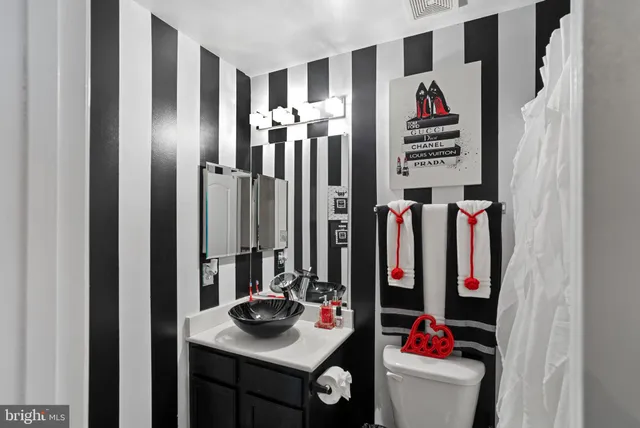 a bed room with a bed and a television