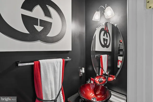 a bedroom with bed and a large window