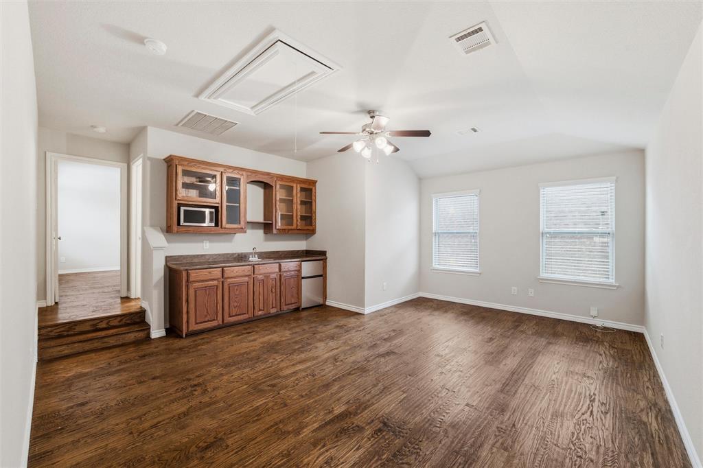420 Prairie Run Aledo, TX 76008 - Photo 25 of 38 a view of a kitchen with a sink and a stove top oven