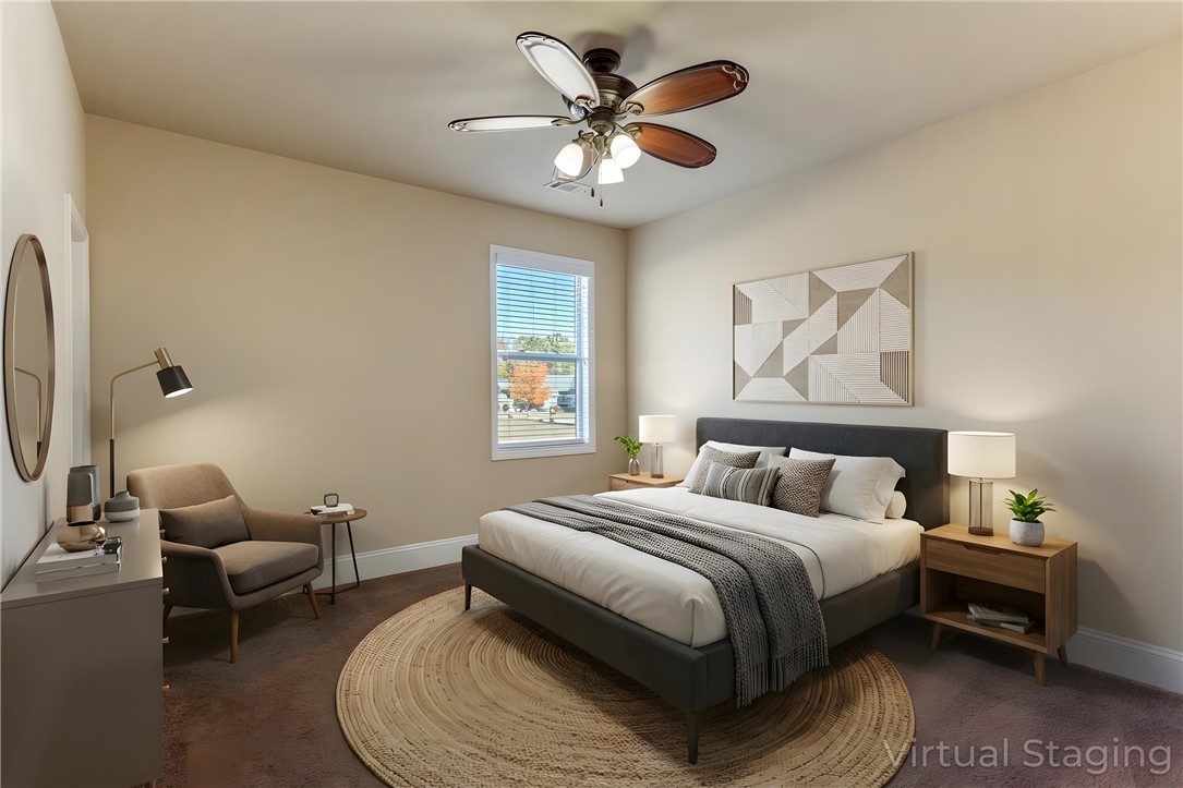 1005 Winmar Drive Anderson, SC 29621 - Photo 7 of 50 This cozy bedroom features a ceiling fan, a window, and comfortable flooring, perfect for relaxation.
