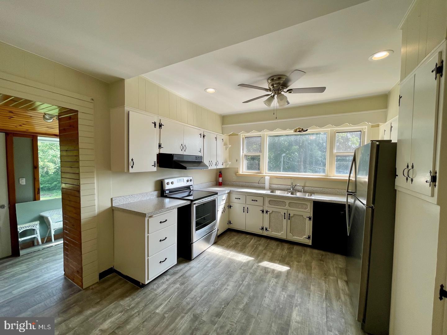 692 Lenni Road Aston, PA 19014 - Photo 8 of 28 a kitchen with stainless steel appliances granite countertop a stove refrigerator sink and microwave