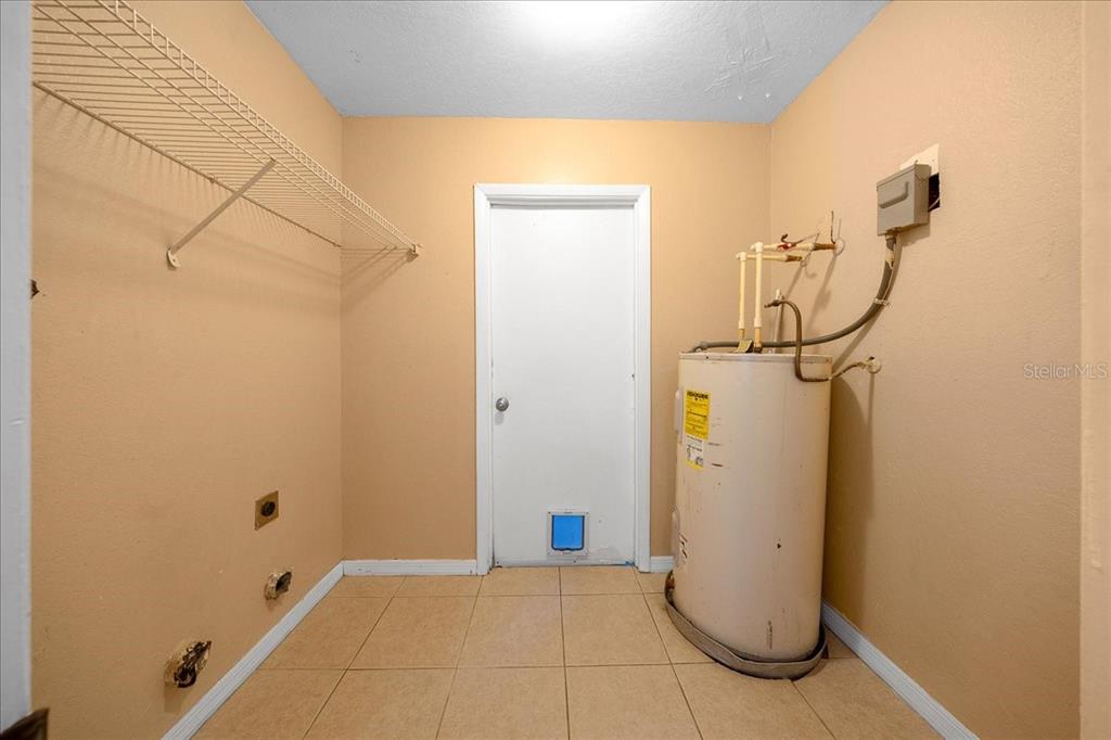 14906 Southwest 38th Circle Ocala, FL 34473 - Photo 17 of 24 a view of water heater room