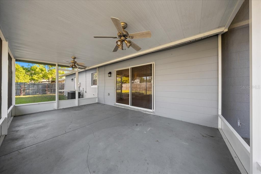 14906 Southwest 38th Circle Ocala, FL 34473 - Photo 20 of 24 a view of a porch with a ceiling fan and a window