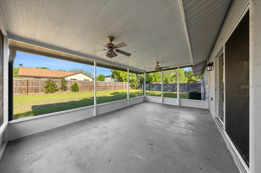 14906 Southwest 38th Circle Ocala, FL 34473 - Photo 21 of 24 a view of an empty room with a sliding door