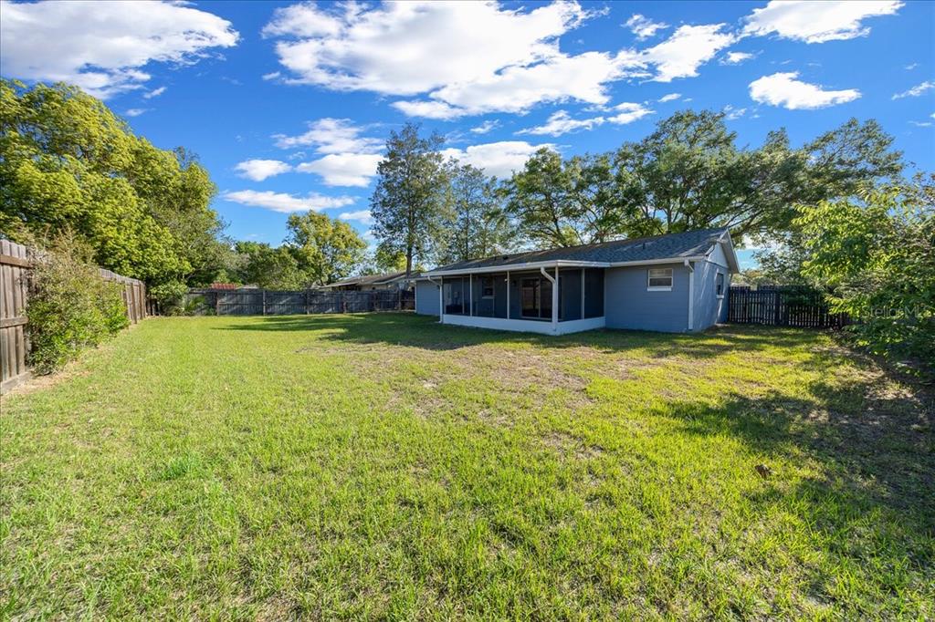 14906 Southwest 38th Circle Ocala, FL 34473 - Photo 23 of 24 a view of a house with a yard