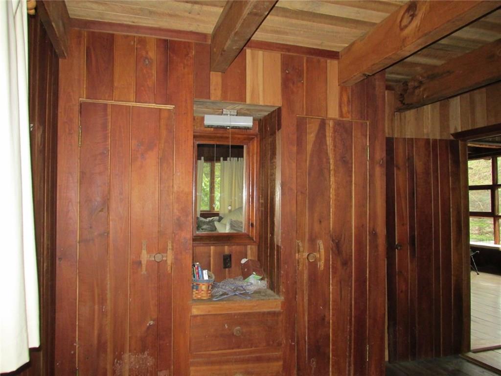 188 County Line Road Champion, PA 15622 - Photo 11 of 25 This is the smallest of the five bedrooms. Note the hardware on the closet drawers and doors. You can see into the living room through the open door.