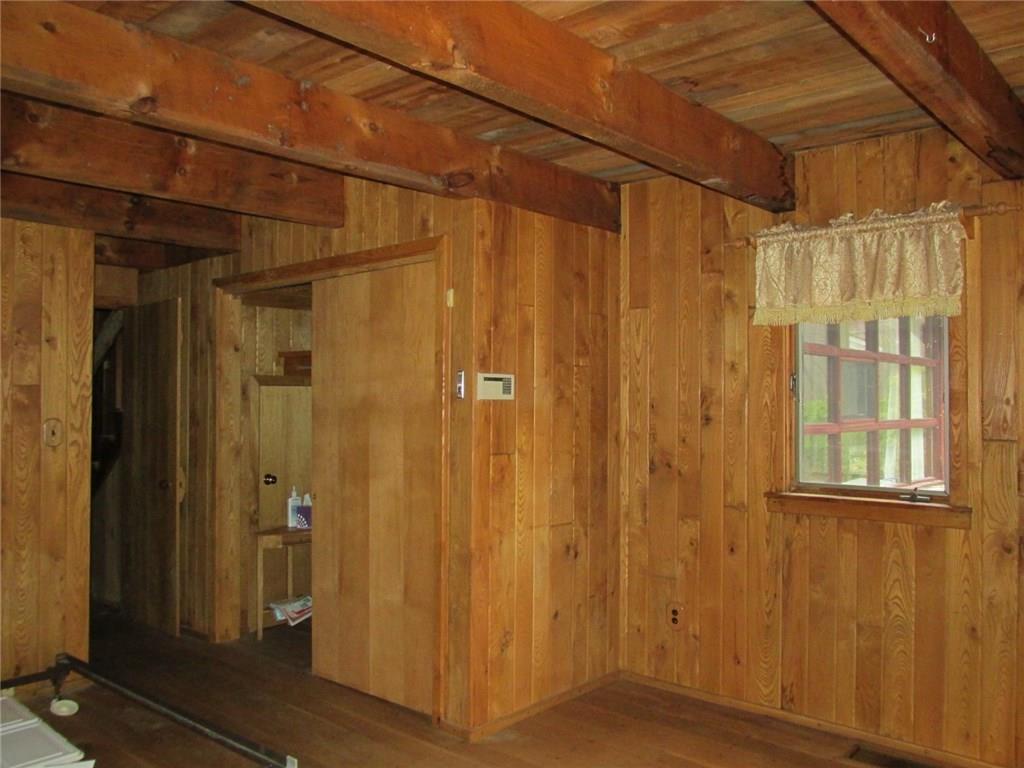 188 County Line Road Champion, PA 15622 - Photo 14 of 25 Closet space and looking back into the hallway through the doorway on the left. This window overlooks the patio.