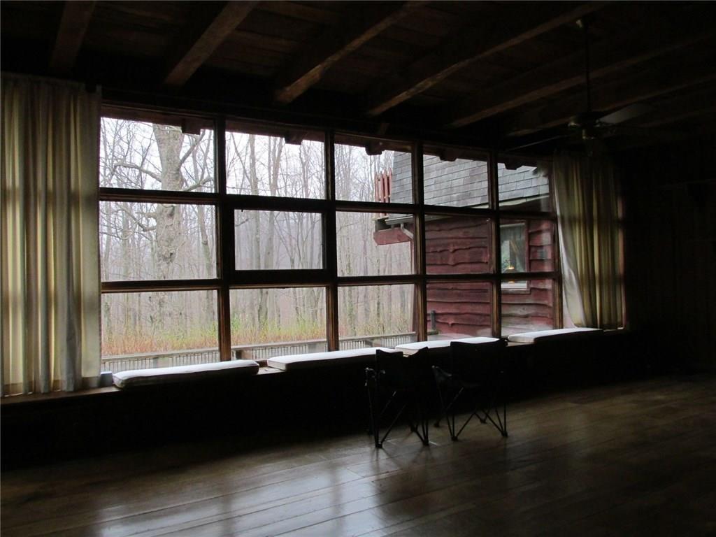 188 County Line Road Champion, PA 15622 - Photo 3 of 25 This wall of windows allows for views down to 2 of the 3 ponds. There is an outside patio that has seen many outdoor festivities over the years!