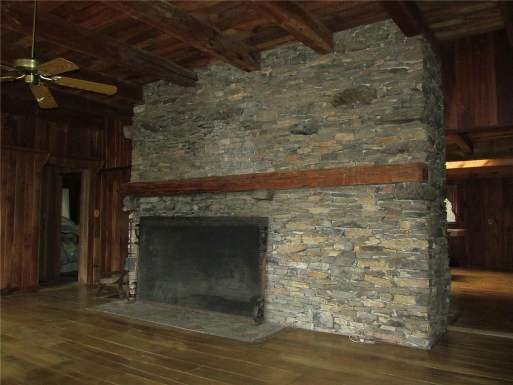 188 County Line Road Champion, PA 15622 - Photo 4 of 25 It is FIVE feet wide! Imagine the fire you can build in this fireplace! On the opposite side is a kitchen fireplace. Note the wood floors! Off to the left are two bedrooms and two full bathrooms.
